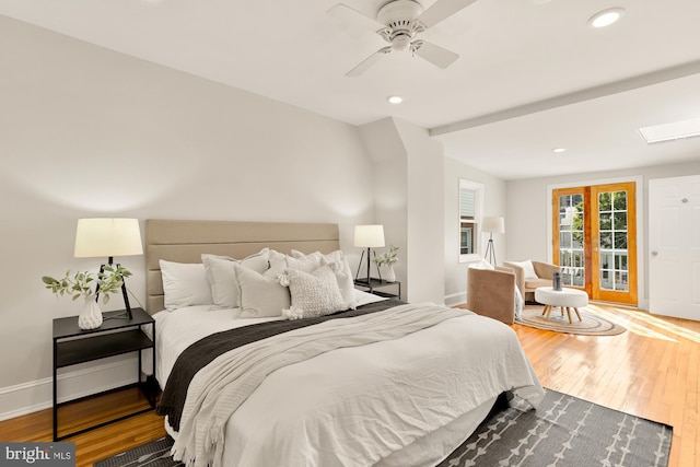 bedroom with hardwood / wood-style flooring, ceiling fan, access to exterior, and french doors