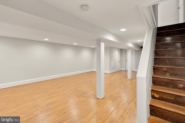 basement featuring light hardwood / wood-style flooring