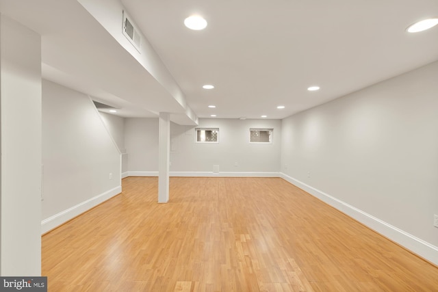 basement featuring light hardwood / wood-style flooring