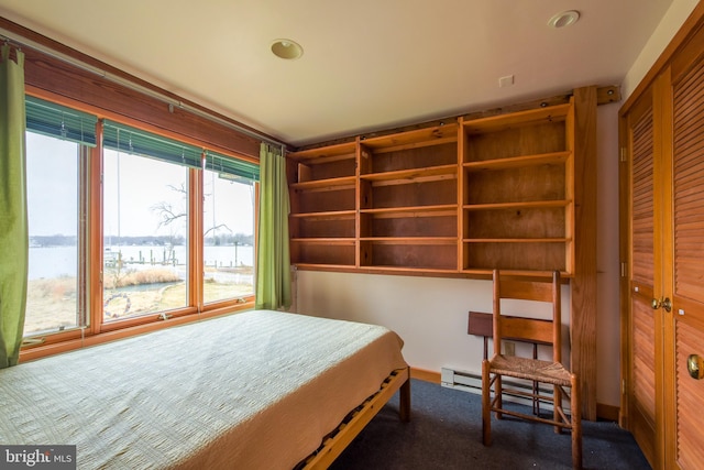 carpeted bedroom featuring a closet
