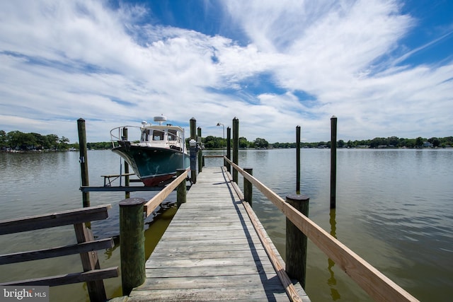 dock area featuring a water view and boat lift