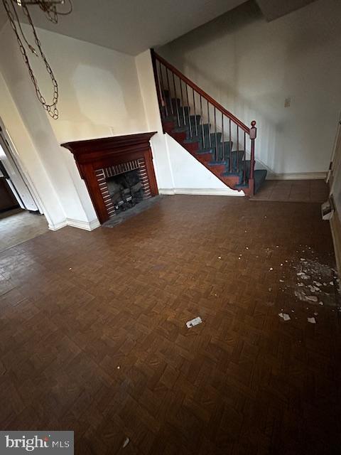 unfurnished living room featuring a fireplace