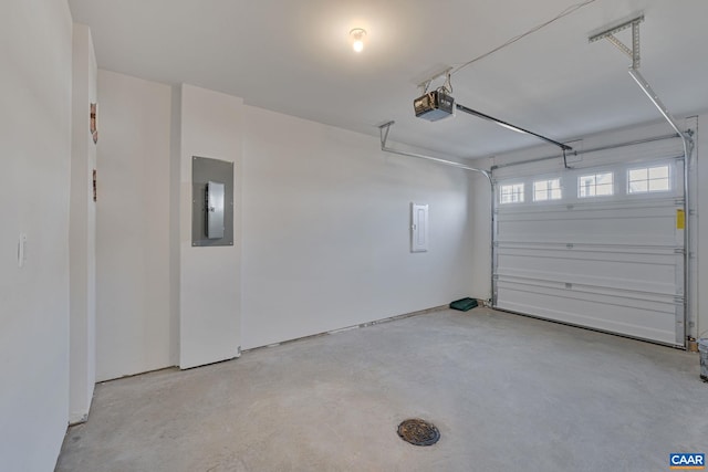 garage with electric panel and a garage door opener