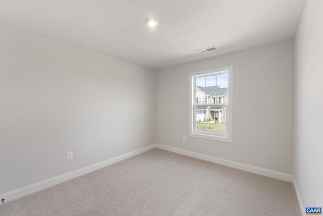 spare room with carpet flooring