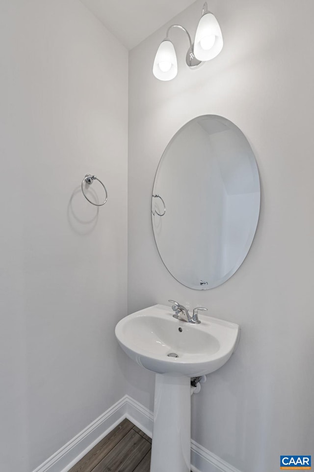 bathroom with hardwood / wood-style flooring