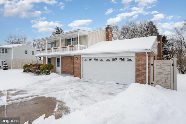 view of front property featuring a balcony and a garage