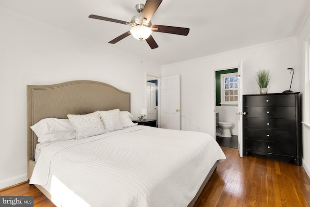 bedroom with ornamental molding, ceiling fan, baseboards, and wood-type flooring