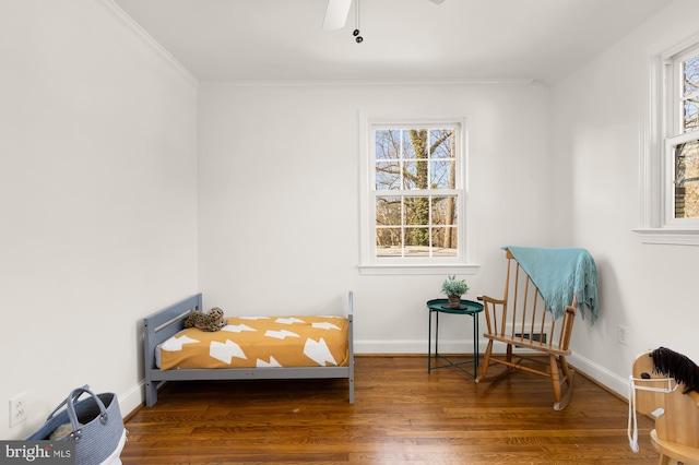 bedroom with ceiling fan, wood finished floors, baseboards, and ornamental molding