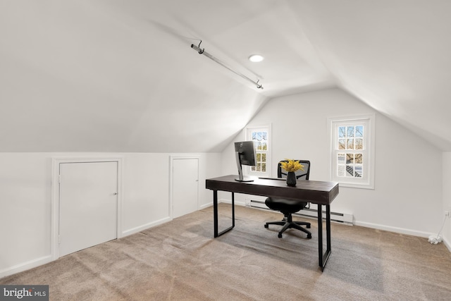 office area with lofted ceiling, baseboard heating, baseboards, and carpet floors