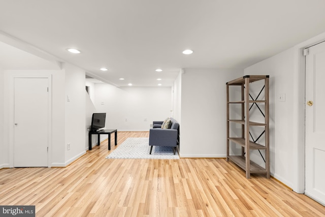 sitting room featuring recessed lighting, baseboards, and wood finished floors