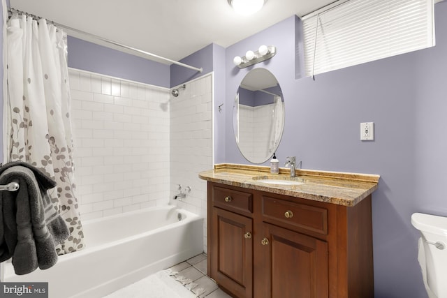 bathroom with vanity, toilet, and shower / tub combo