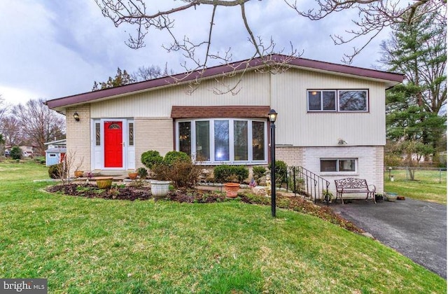 view of front of home with a front lawn