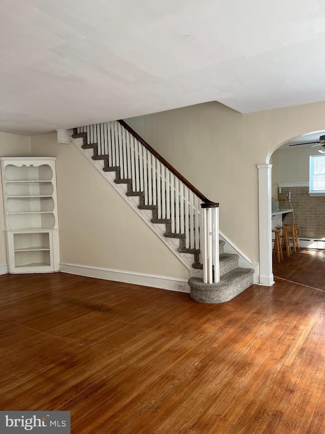 interior space featuring ceiling fan and wood-type flooring