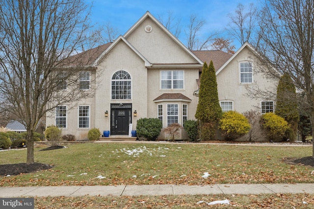 view of front of home featuring a front yard