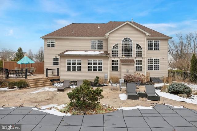 rear view of house featuring a patio area and a deck