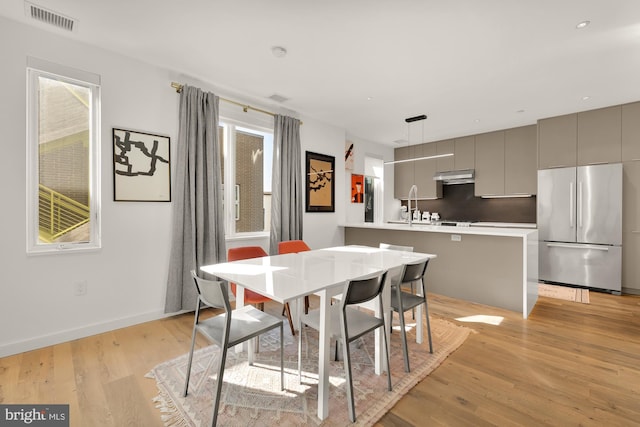 dining room featuring light hardwood / wood-style floors and plenty of natural light