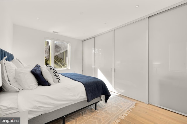 bedroom featuring a closet and hardwood / wood-style floors