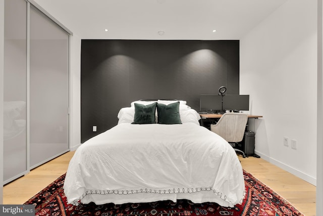 bedroom with light hardwood / wood-style flooring