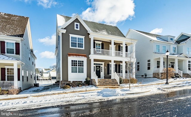 view of front of home with a porch and a balcony