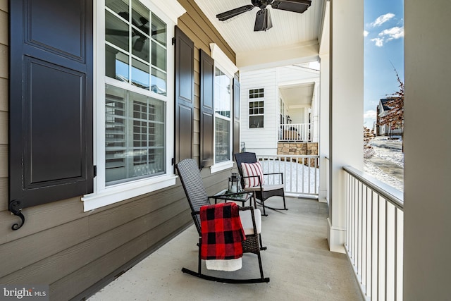 balcony featuring ceiling fan and a porch