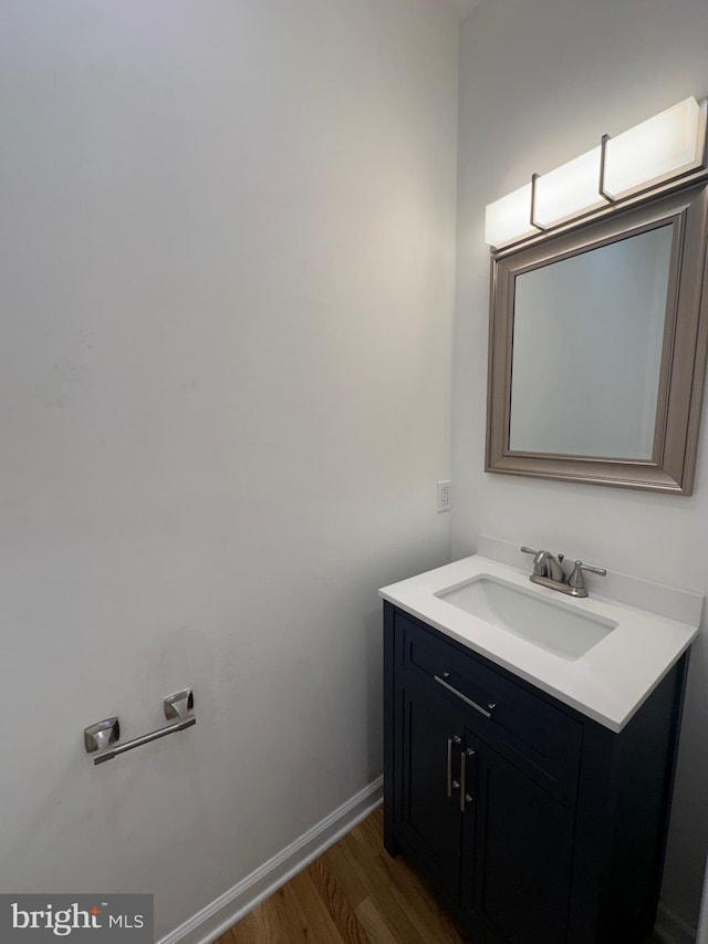 bathroom with vanity and wood-type flooring