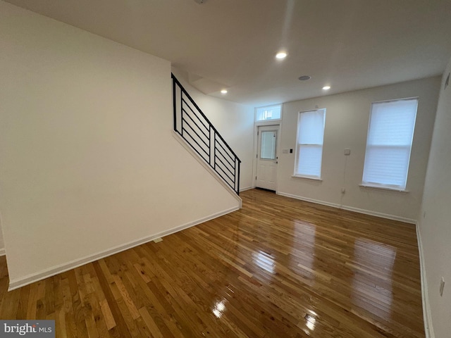 unfurnished living room with hardwood / wood-style flooring