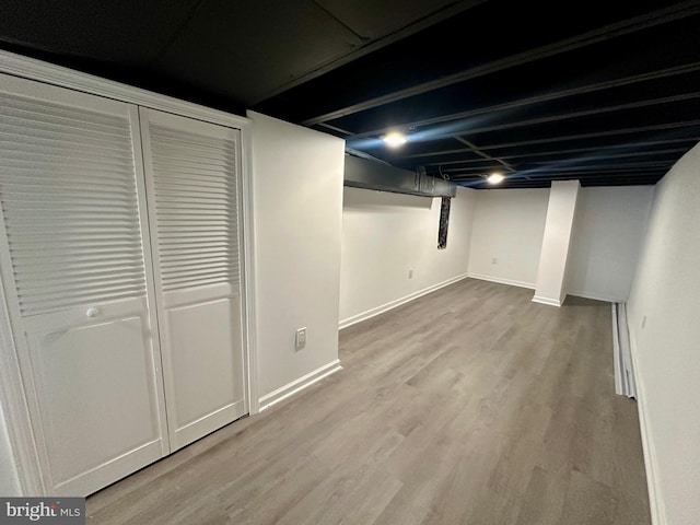 basement with wood-type flooring