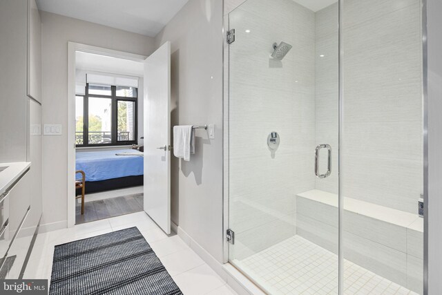 bathroom featuring tile patterned floors and an enclosed shower