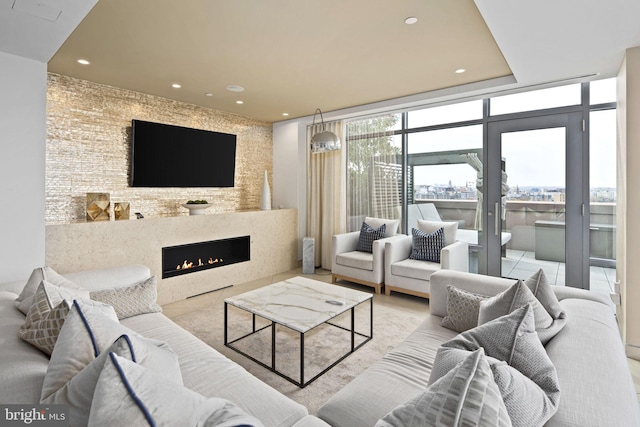 living room featuring a wall of windows