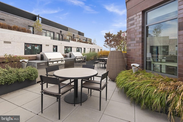 balcony with a patio, area for grilling, and a grill