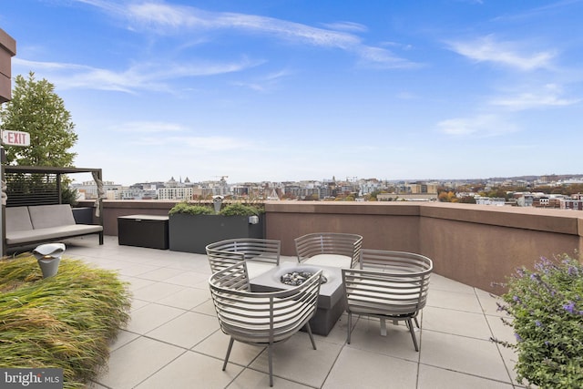 view of patio / terrace with a fire pit