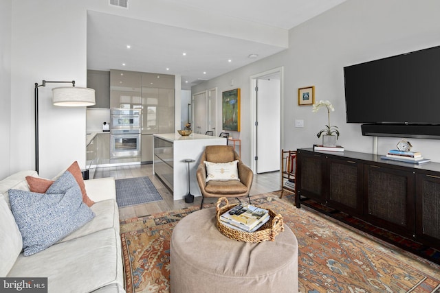 living room with light hardwood / wood-style floors