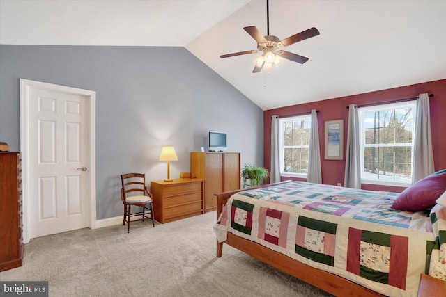 carpeted bedroom featuring ceiling fan and vaulted ceiling