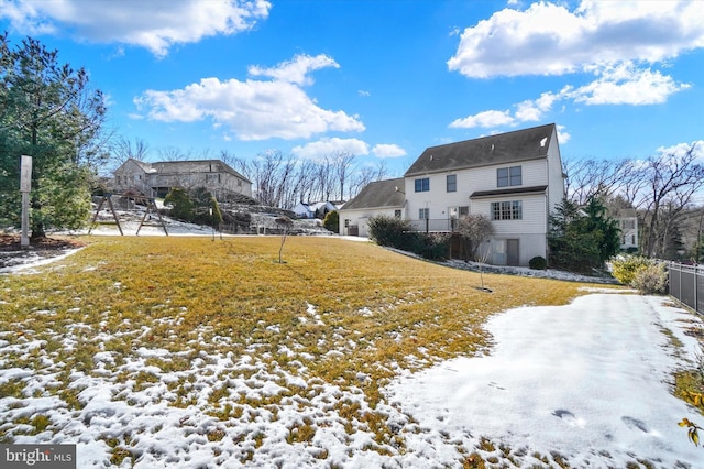 view of yard layered in snow