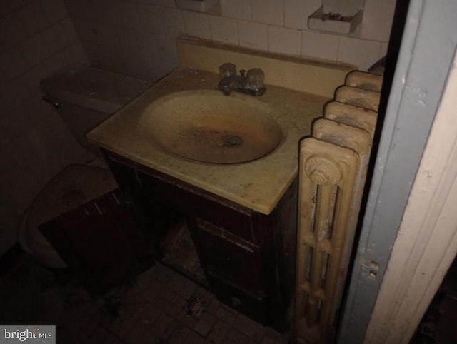 bathroom with vanity and toilet