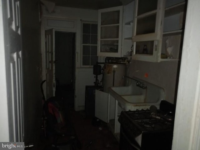 kitchen with white range with gas stovetop and sink