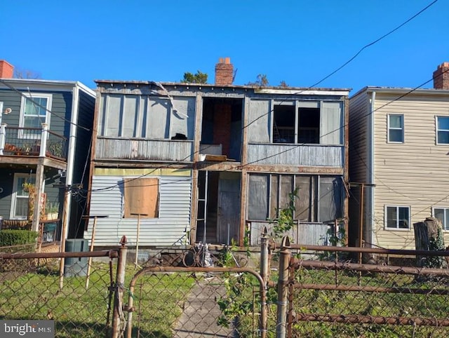 rear view of house featuring a balcony