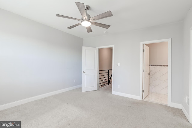 unfurnished bedroom with light carpet, ensuite bath, and ceiling fan