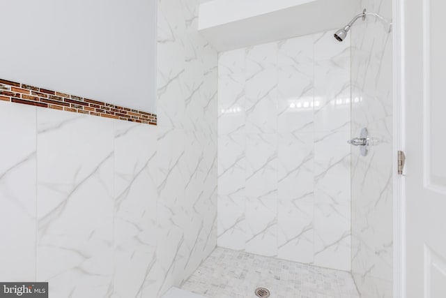 bathroom with tiled shower