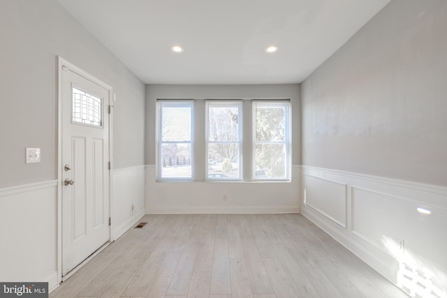 foyer with light wood-type flooring