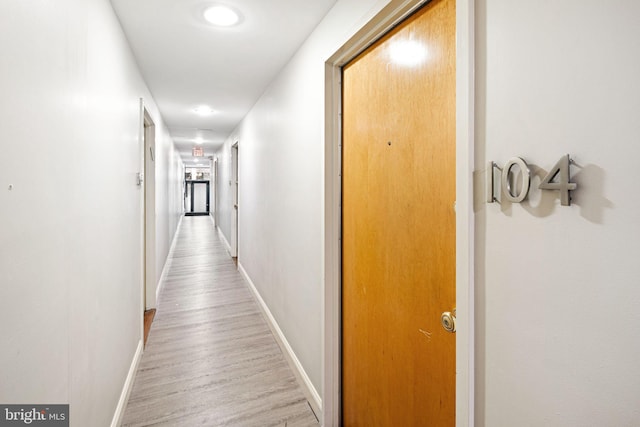 hall with light hardwood / wood-style floors