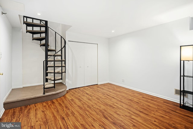 interior space with hardwood / wood-style flooring and a closet