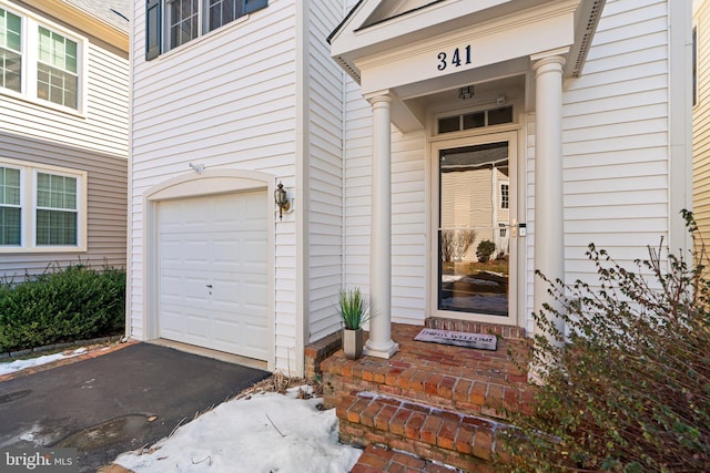 property entrance featuring a garage