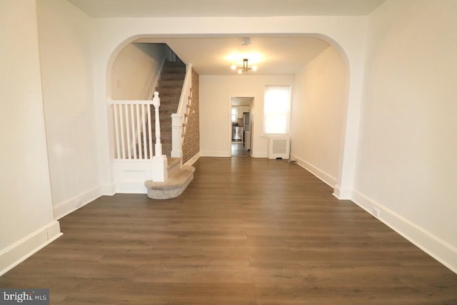 hall with dark wood-type flooring