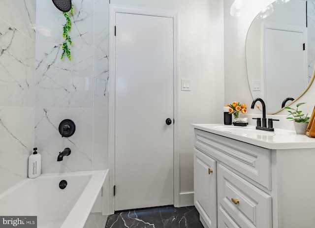 bathroom with vanity and tiled shower / bath