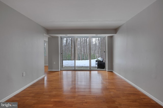 empty room with light hardwood / wood-style floors