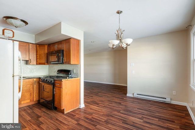 kitchen with dark hardwood / wood-style flooring, a baseboard heating unit, backsplash, a chandelier, and black appliances