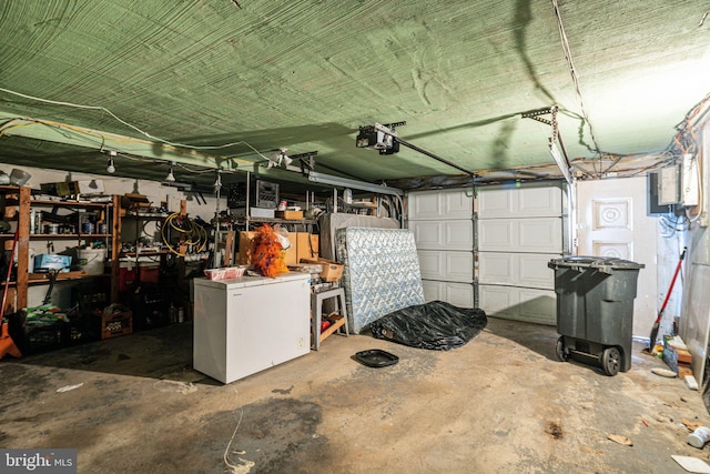 garage featuring a garage door opener and fridge