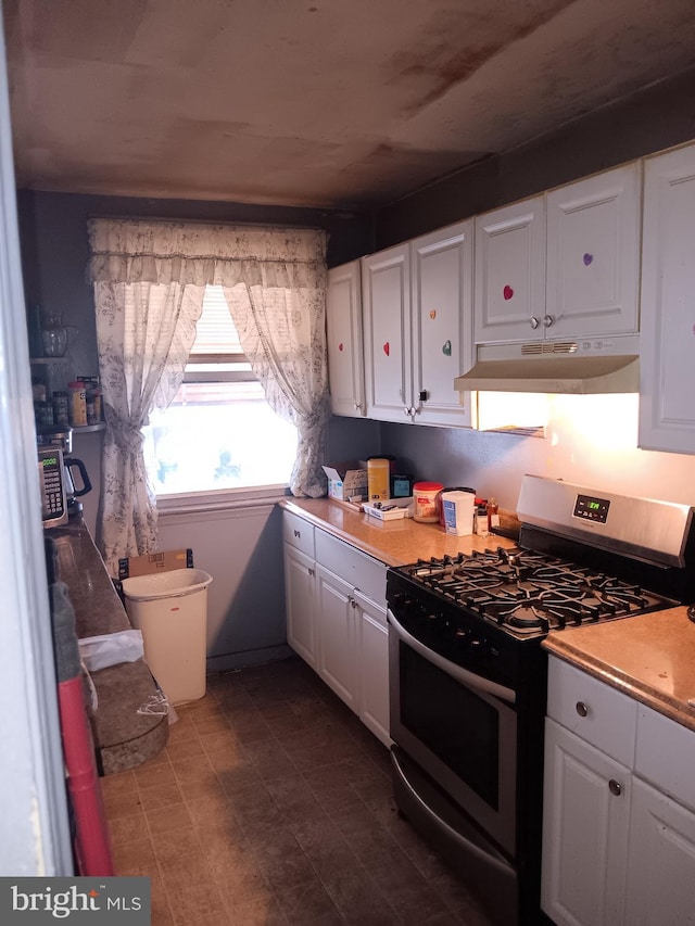 kitchen with white cabinetry and stainless steel range with gas stovetop