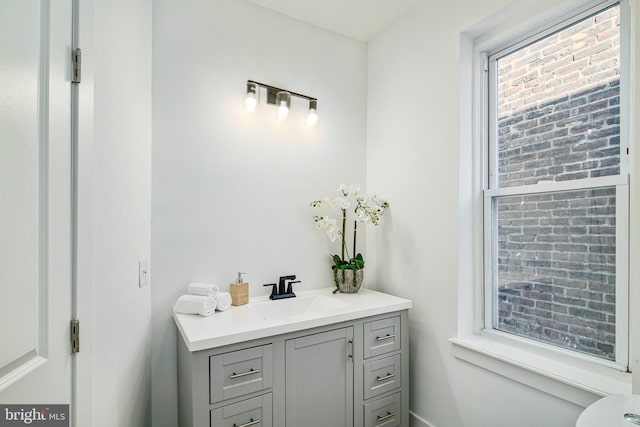 bathroom with vanity and a healthy amount of sunlight